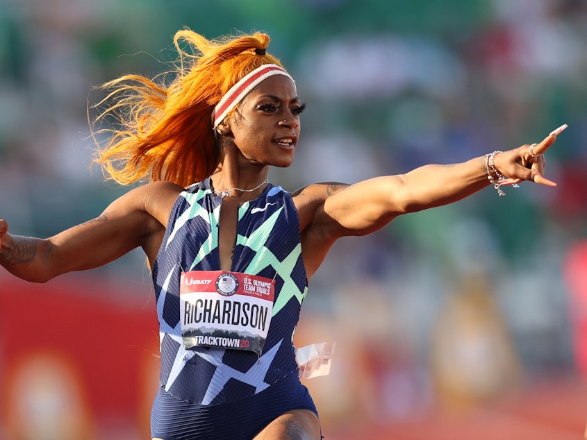 caption: Sha'Carri Richardson celebrates in the 100-meter semifinal last month at the U.S. Olympic track and field team trials in Eugene, Ore. However, a positive drug test disqualified her result at the trials.