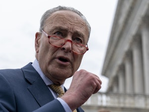 caption: Senate Majority Leader Chuck Schumer of New York speaks with reporters on Capitol Hill on Tuesday.