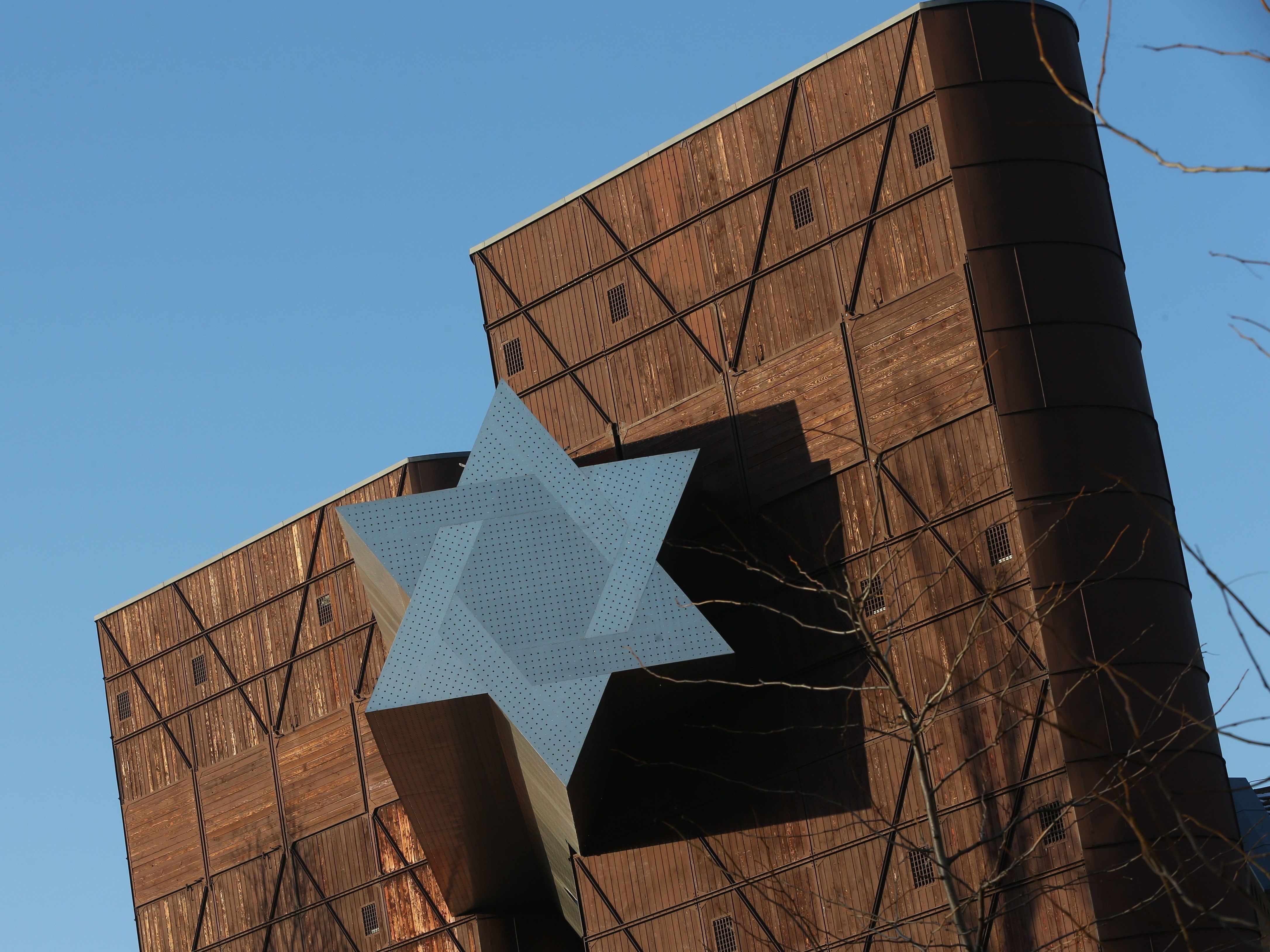 caption: The long-delayed opening of the House of Fates Holocaust museum in Budapest, whose entrance is marked by a Star of David, is expected this spring.