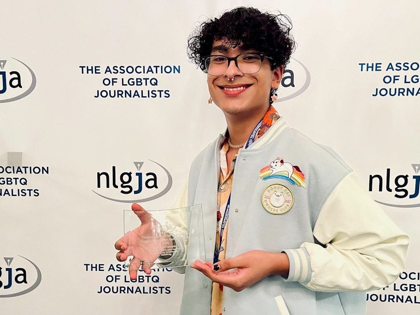 caption: RadioActive's Antonio Nevarez receives the Excellence in Student Journalism Award from NLGJA: The Association of LGBTQ Journalists on Saturday, September 10, 2022 in Chicago, Illinois.