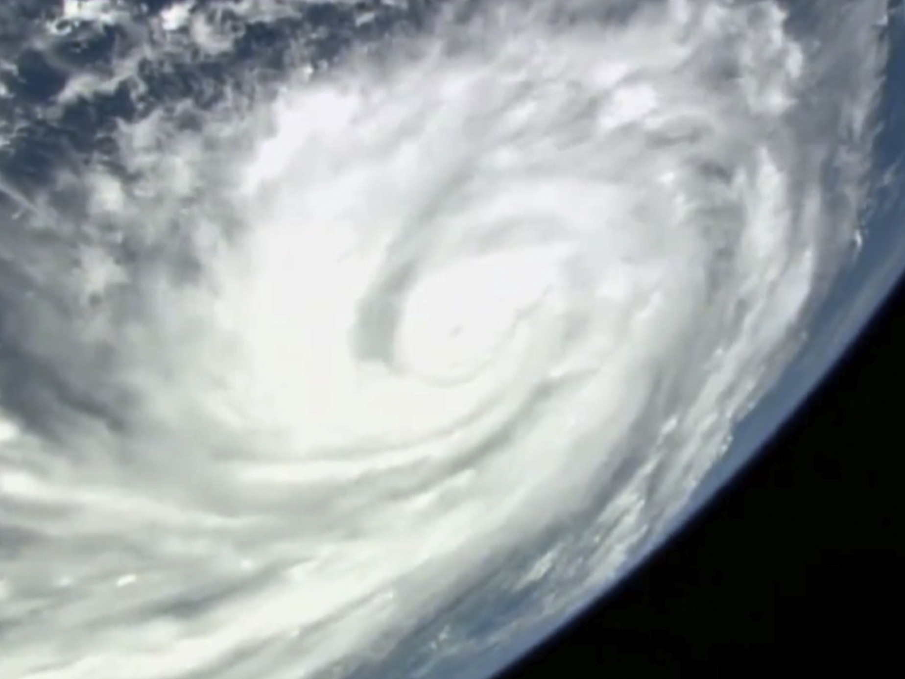caption: This image provided by NASA shows Hurricane Ian seen below the International Space Station as the storm was gaining strength south of Cuba and moving toward Florida Monday afternoon