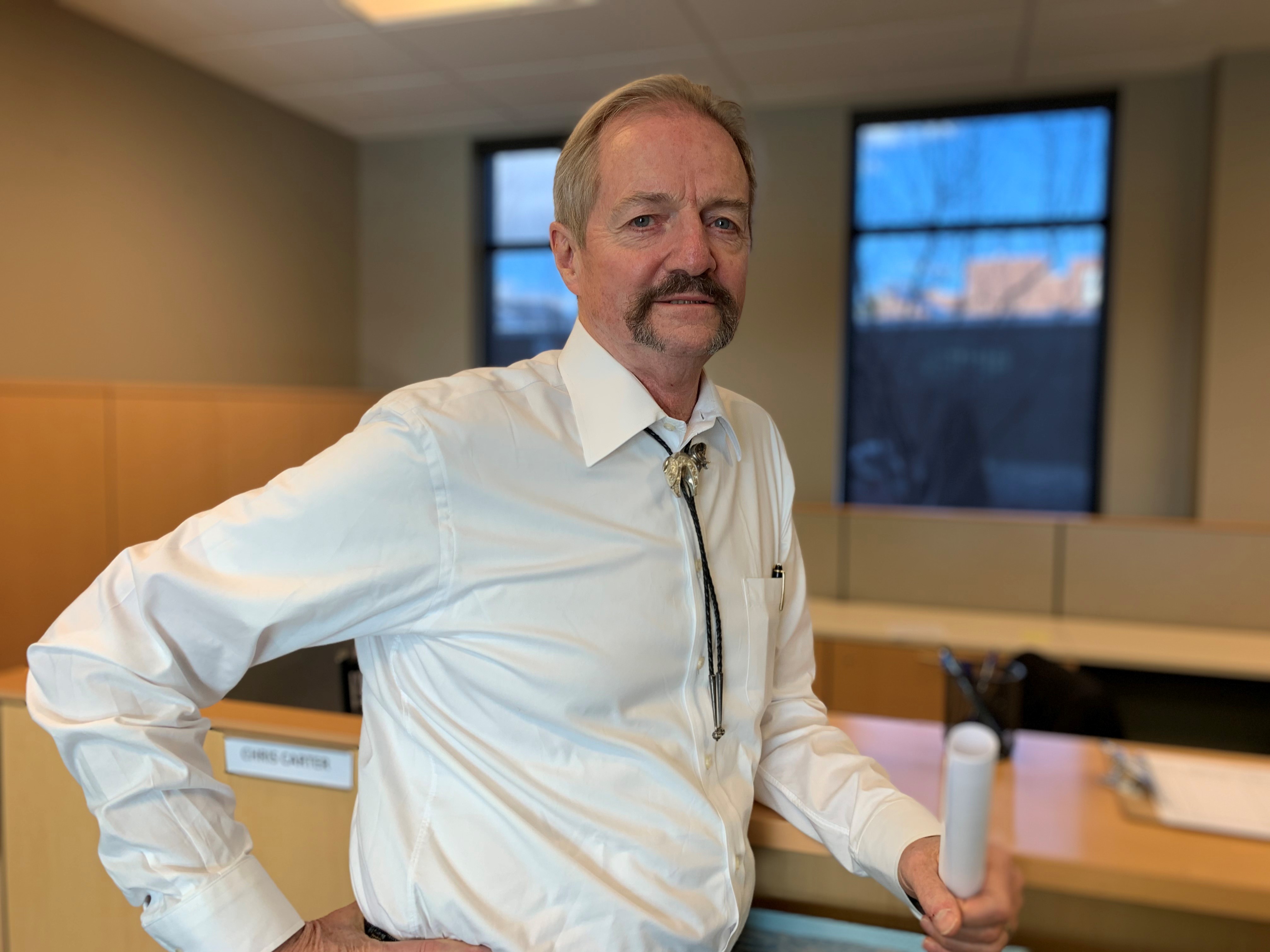 caption: Acting BLM Director William Perry Pendley stands in the mostly empty suite of offices at the agency's new planned headquarters in Grand Junction, Colo.