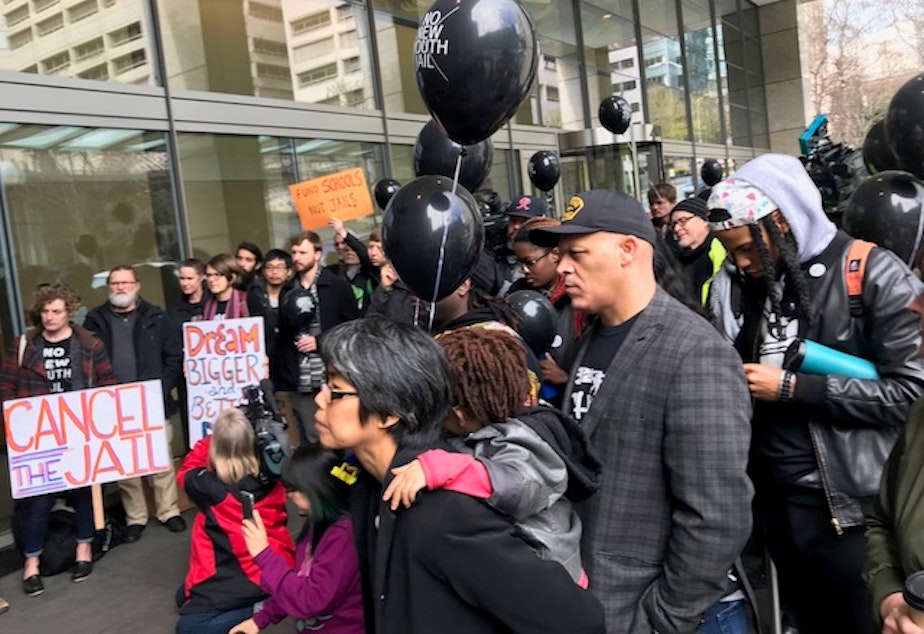 caption: No Youth Jail activists protested outside the county building in downtown Seattle. Inside a delegation were meeting with King County Executive Dow Constantine