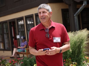 caption: NBCUniversal CEO Jeff Shell speaks to the media at the Allen & Company Sun Valley Conference in July 2021 in Sun Valley, Idaho. Shell is out of his job after an "inappropriate relationship."