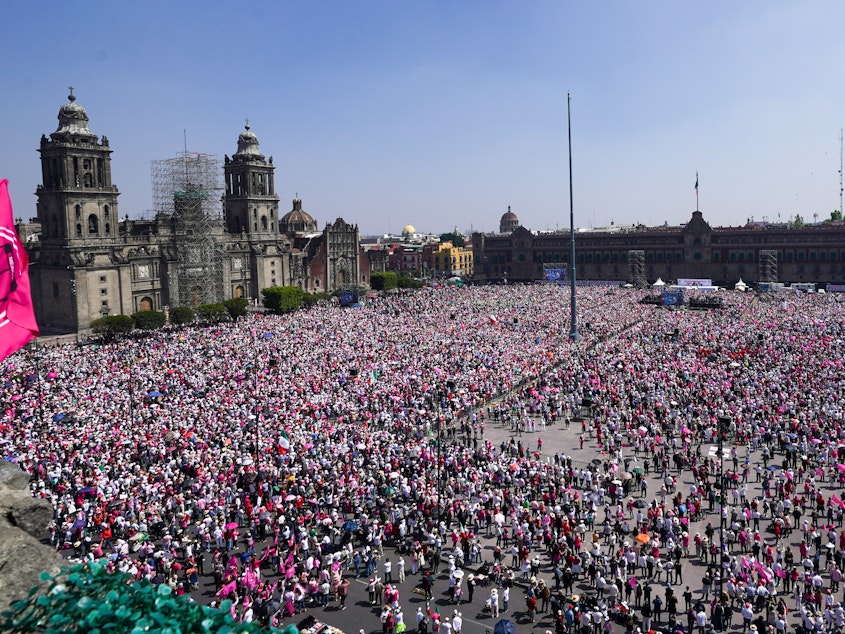 caption: People take parte in a march organized by citizen organizations demanding that electoral autonomy be respected in the upcoming general elections in downtown Mexico City, Sunday, Feb. 18, 2024.