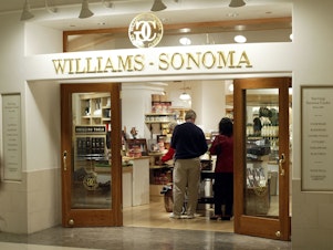 caption: Shoppers browse at a Williams Sonoma in Chicago, Ill., on May 22, 2003.