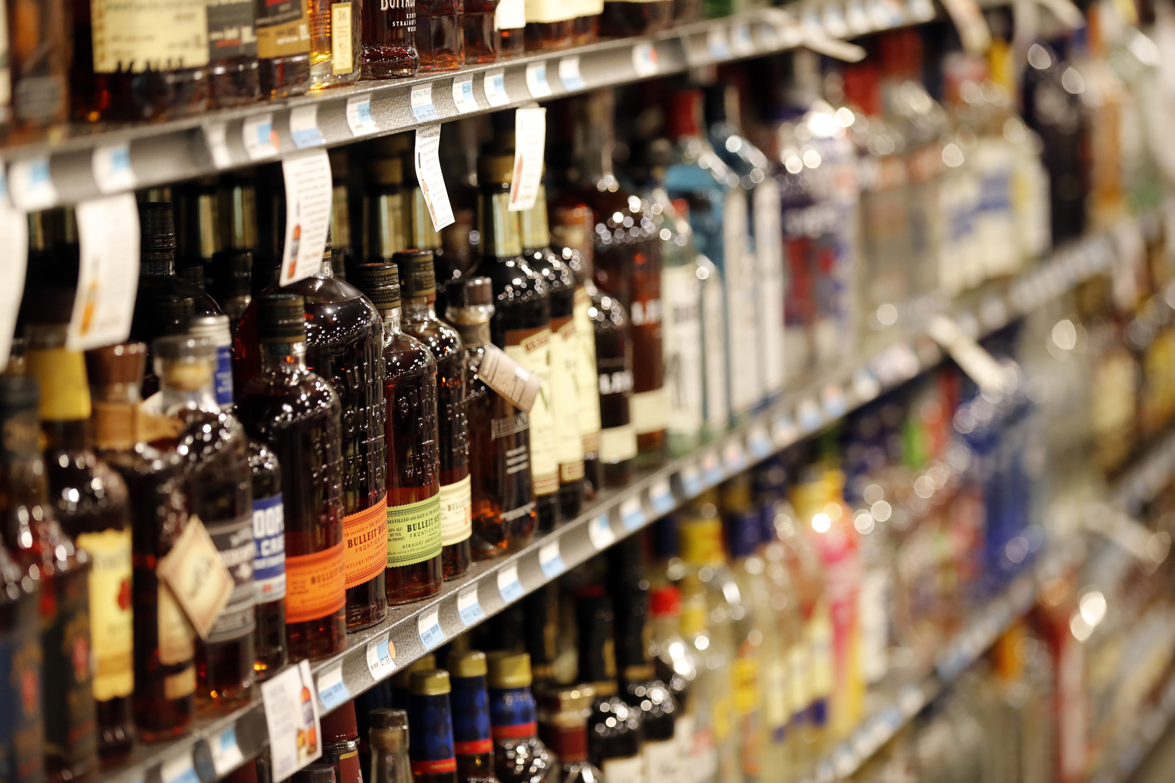 caption: Liquor bottles are seen on display at a grocery store in River RIdge, La., Wednesday, July 11, 2018. (AP Photo/Gerald Herbert)