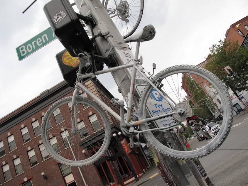 caption: Ghost bikes appear in Seattle in places where riders are hurt by motorists.