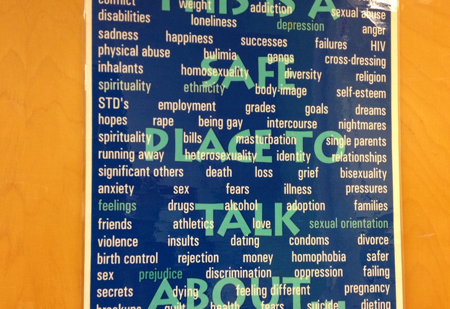 caption: A poster at Rainier Beach High School's teen clinic lets students know they have a safe place to talk.