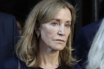 caption: Actress Felicity Huffman leaves federal court after her sentencing in a nationwide college admissions bribery scandal in Boston last month.