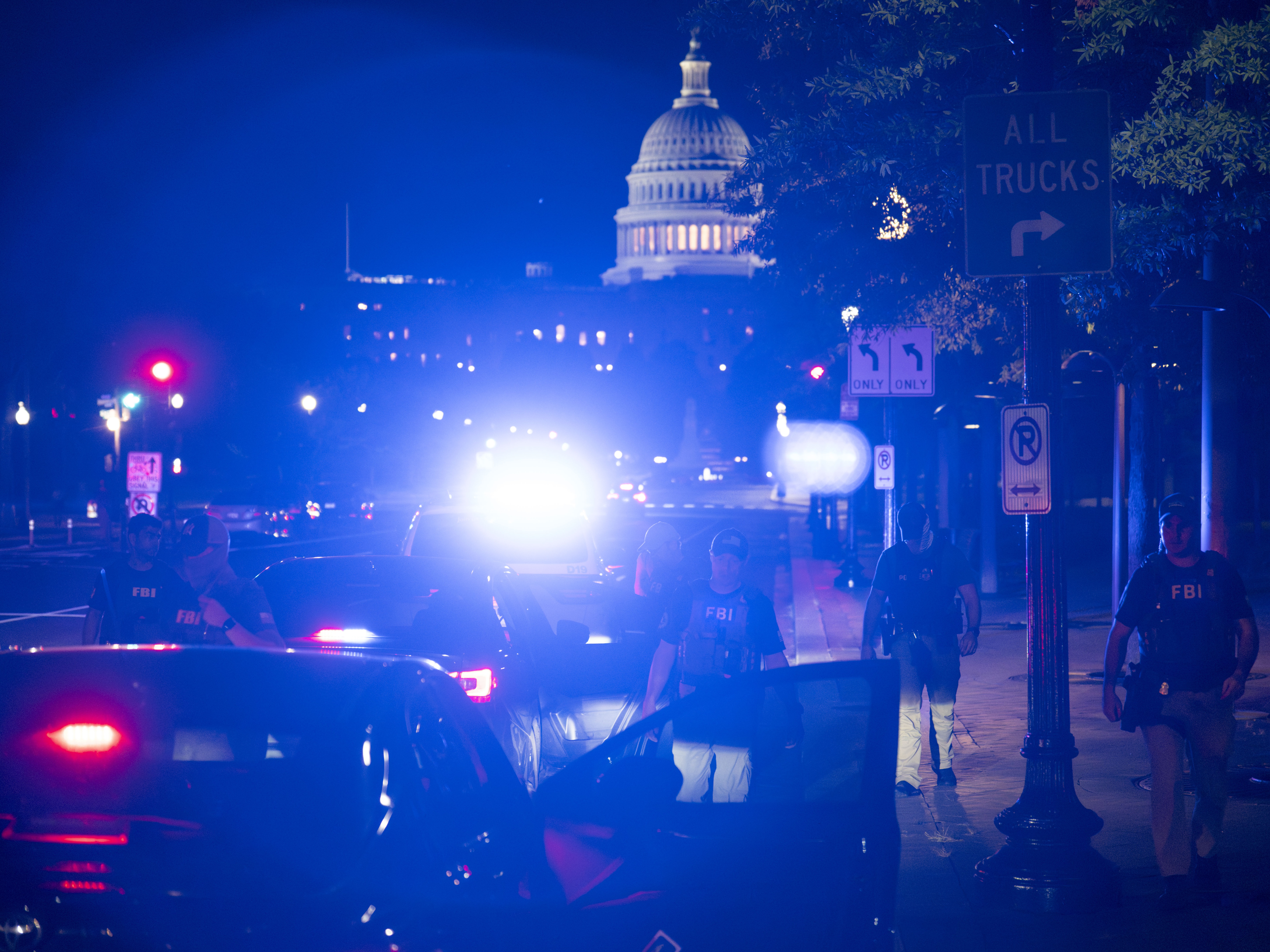 caption: Members of the FBI and D.C.'s Metropolitan Police Department conduct a traffic stop near the U.S. Capitol in Washington, D.C., on Aug. 14.