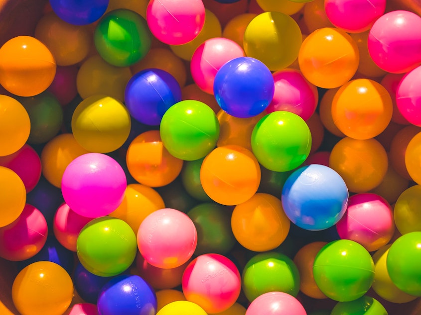 A colorful close up of a ball pit