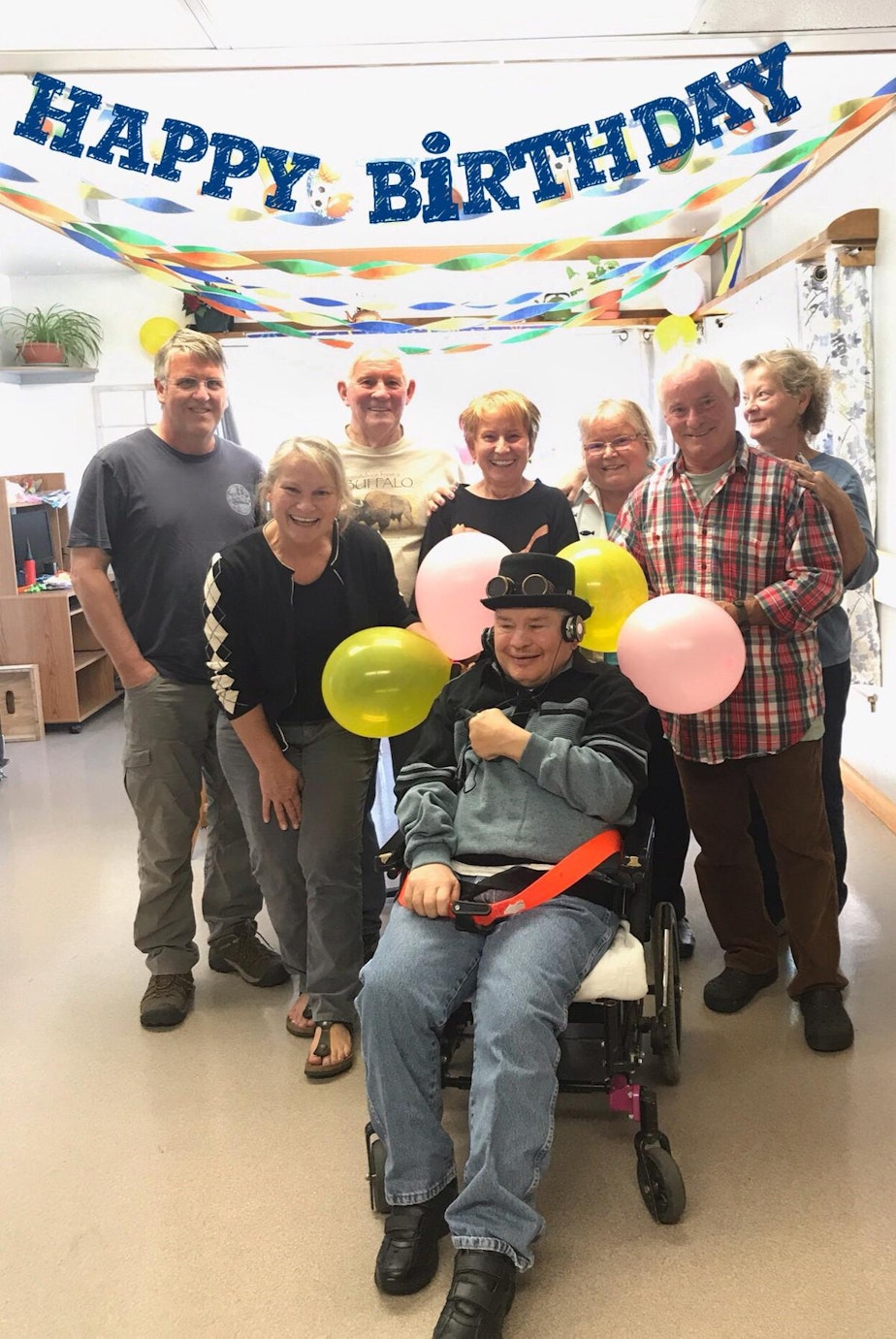 caption: Gregory Paul is pictured with his siblings during his 65th birthday party at the Rainier School two years ago.