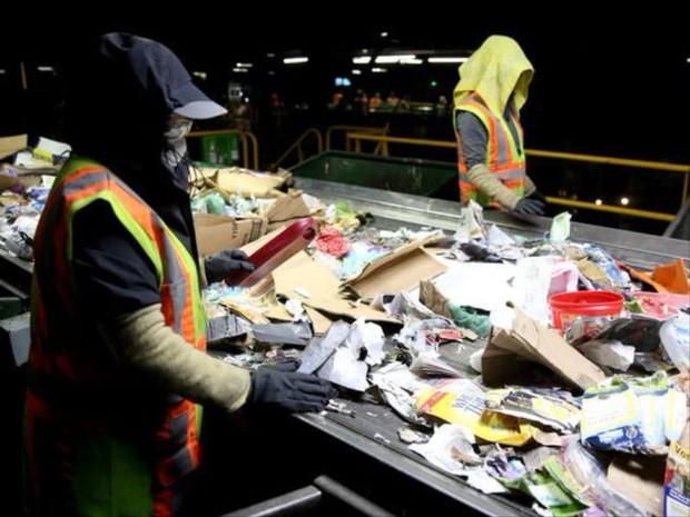 caption: <p>Recycling sorters pull non-recyclables off a conveyer belt at Garten Services in Salem on Thursday, Jan. 11, 2018.</p>