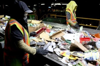 caption: <p>Recycling sorters pull non-recyclables off a conveyer belt at Garten Services in Salem on Thursday, Jan. 11, 2018.</p>