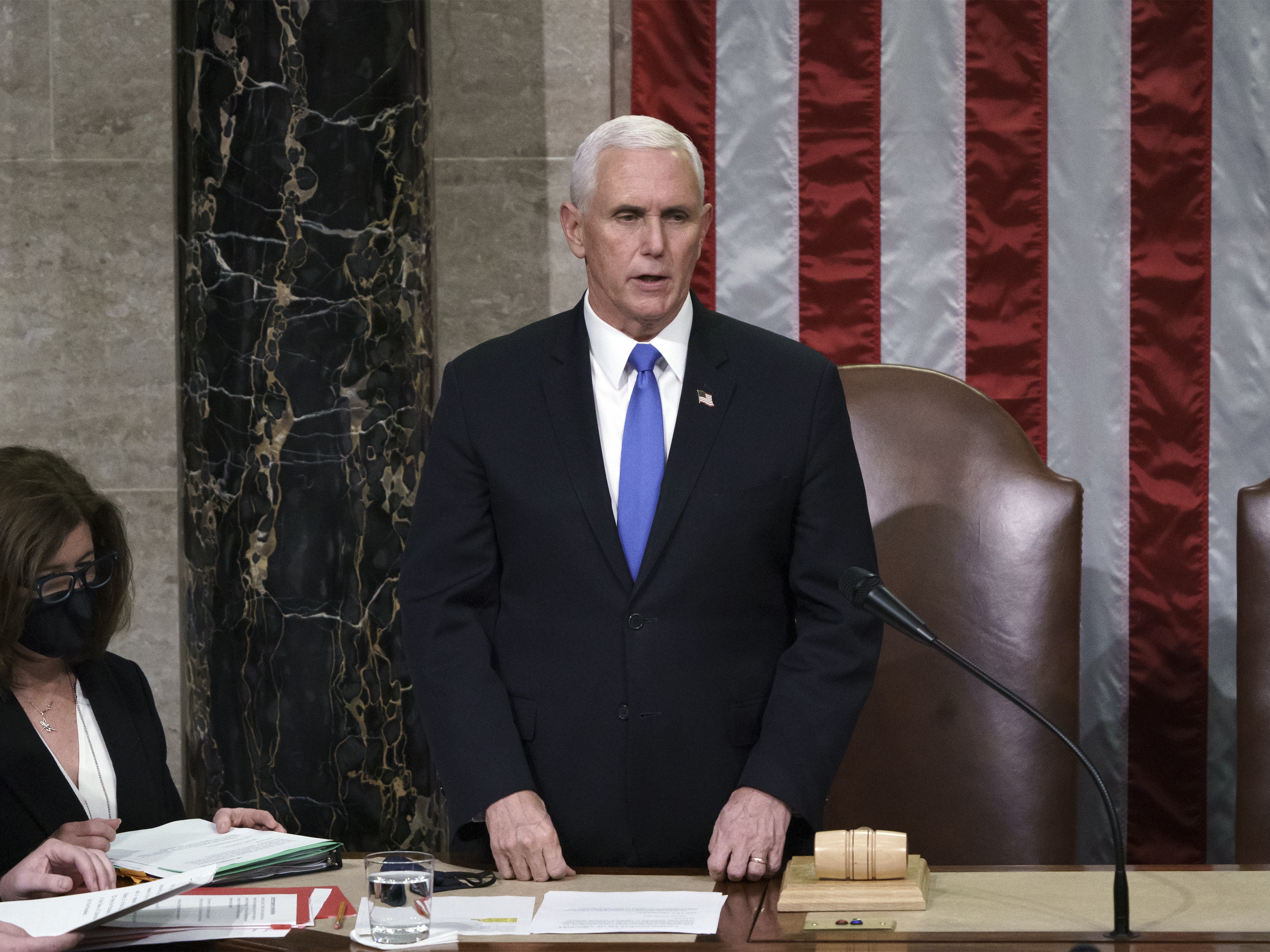 caption: Then-Vice President Mike Pence reads the final certification of Electoral College votes after the Jan. 6 Capitol riot in 2021. A new law clarifies that the vice president's role in the counting of electoral votes is ministerial. Congress will count the votes from the 2024 presidential election on Monday.