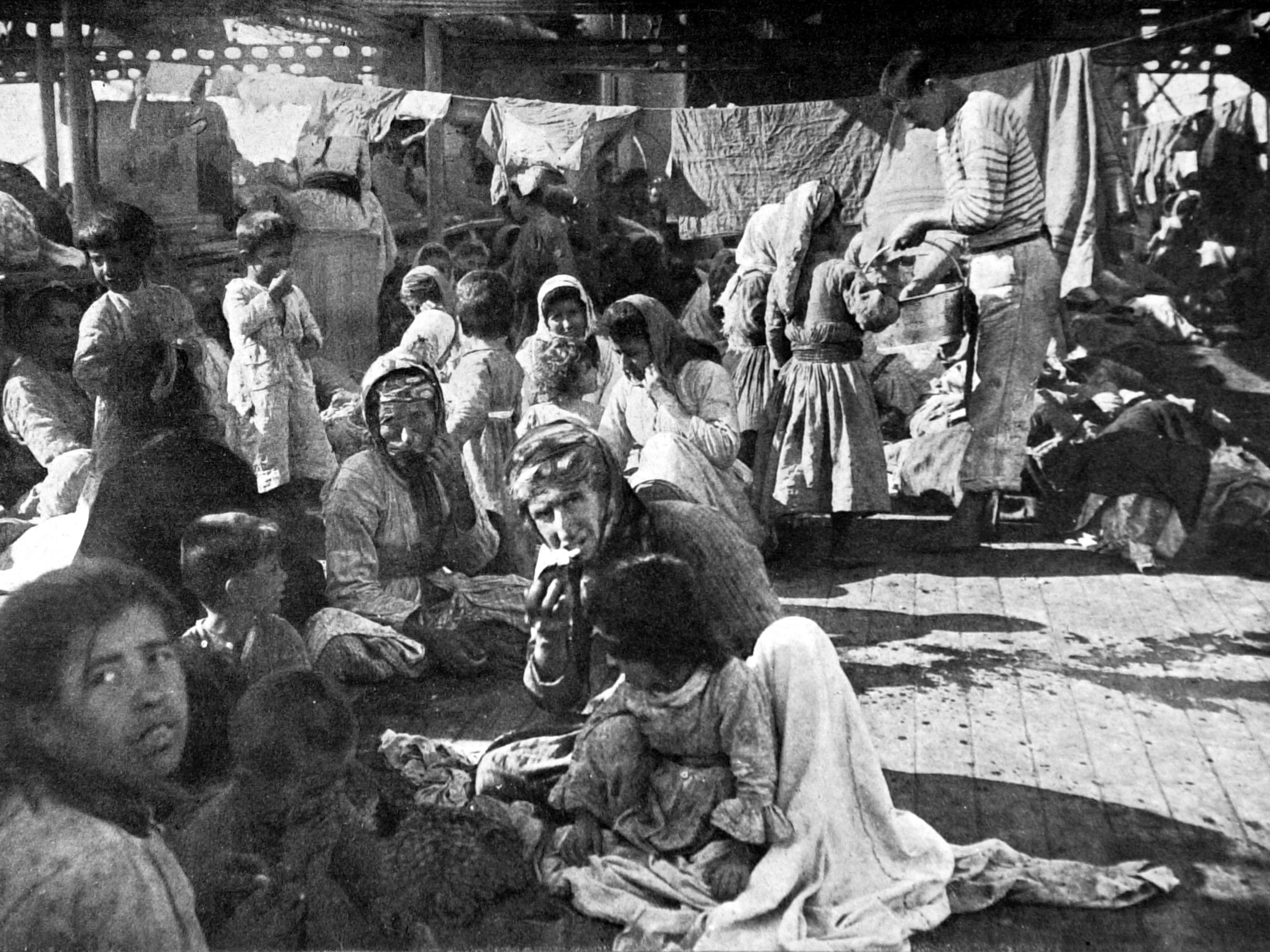 caption: Armenian refugees on the deck of the French cruiser that rescued them in 1915 during the massacre of the Armenian populations in the Ottoman Empire.