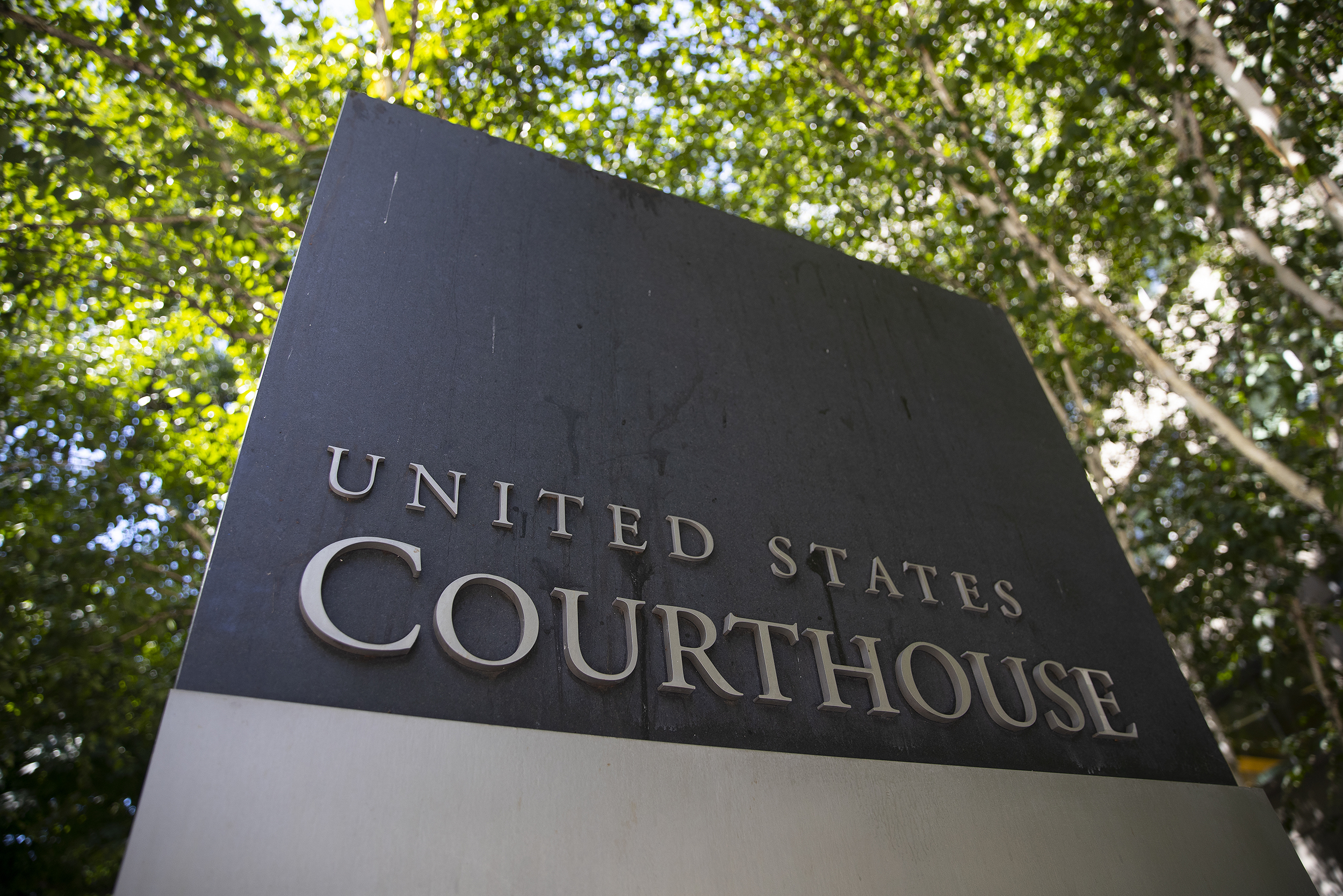 caption: The U.S. District Court sign is shown on Thursday, August 17, 2023, along Stewart Street in downtown Seattle.
