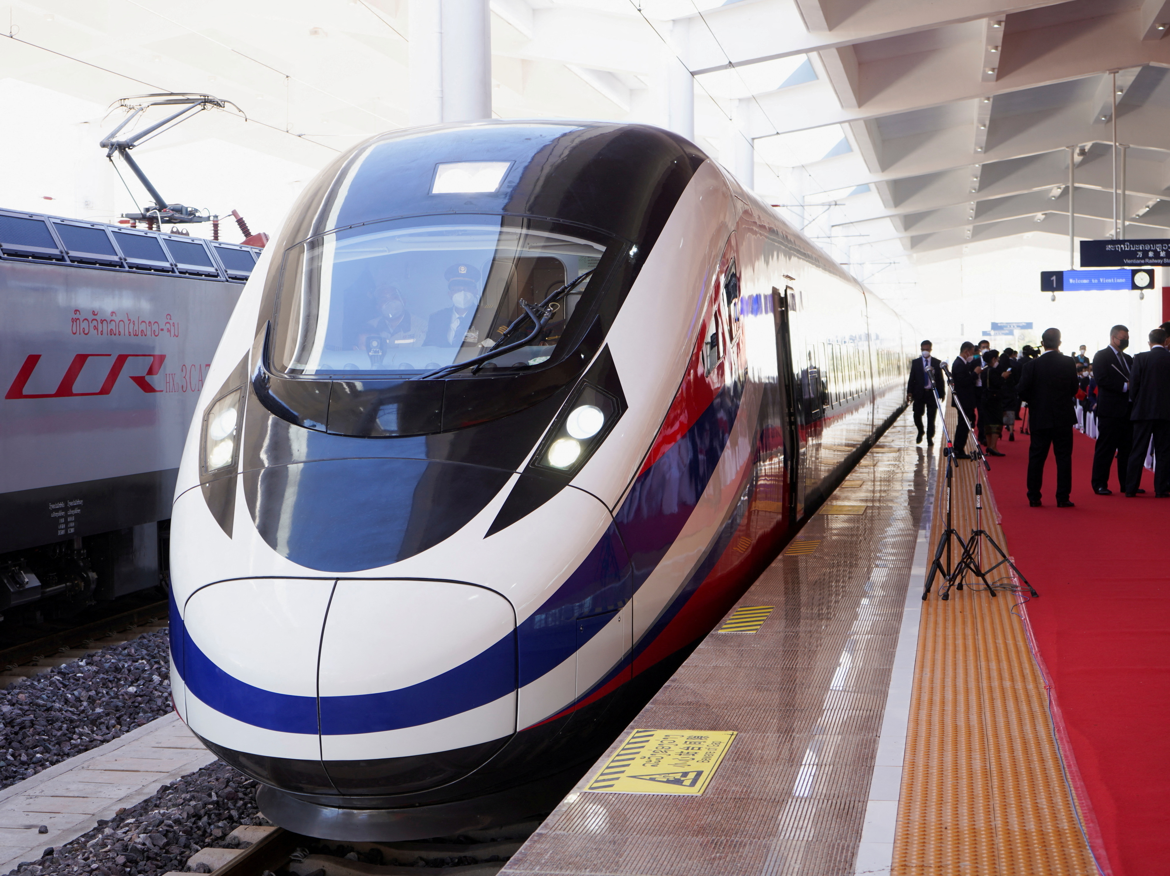 caption: A train is ready on the station during the handover ceremony of the high-speed rail project in Vientiane, Laos, connecting the city with Kunming, China, on Dec. 3, 2021.