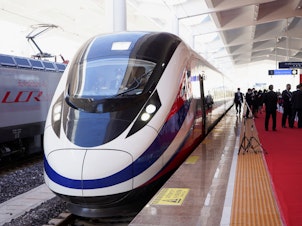 caption: A train is ready on the station during the handover ceremony of the high-speed rail project in Vientiane, Laos, connecting the city with Kunming, China, on Dec. 3, 2021.