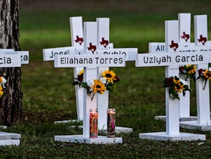 caption: Crosses adorn a makeshift memorial for the shooting victims at Robb Elementary School. NPR has not independent verified the names.