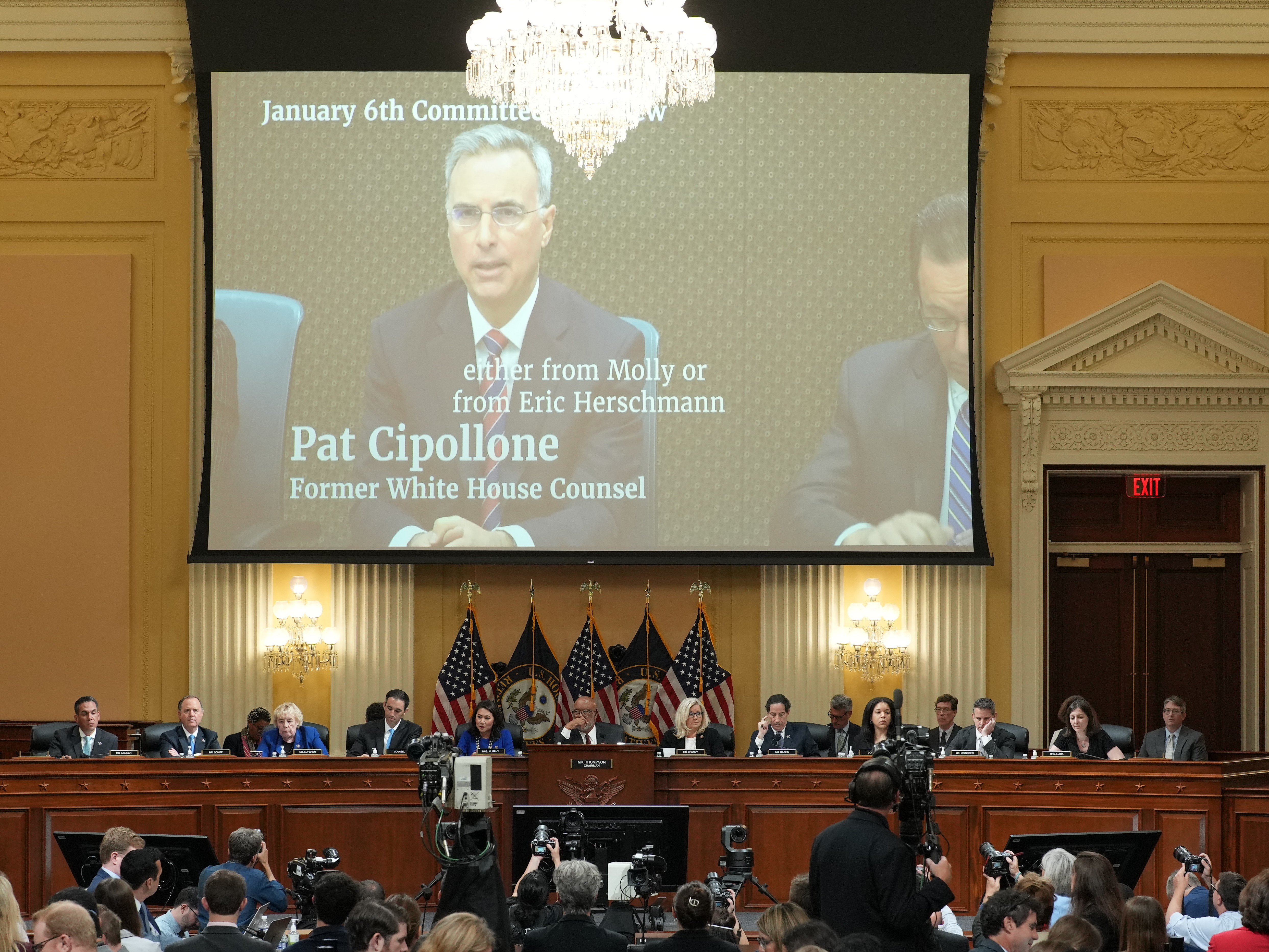 caption: A video of Pat Cipollone, former White House counsel, is shown on a screen during the seventh hearing held by the Select Committee to Investigate the January 6th Attack on the U.S. Capitol on Tuesday.