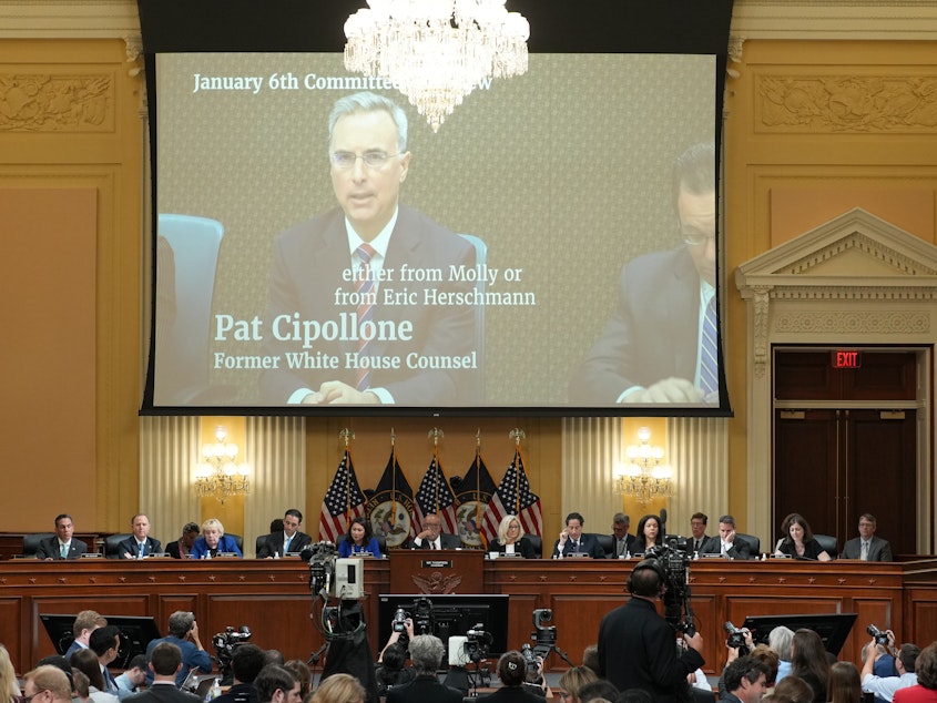 caption: A video of Pat Cipollone, former White House counsel, is shown on a screen during the seventh hearing held by the Select Committee to Investigate the January 6th Attack on the U.S. Capitol on Tuesday.