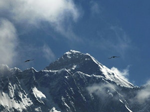 caption: The official height of Mount Everest, seen here last year from Namche Bajar, Nepal, has been the subject of intense negotiations between Nepal and neighboring China. On Tuesday, they announced a revised number both countries have agreed upon: 8,849 meters, or about 29,032 feet.
