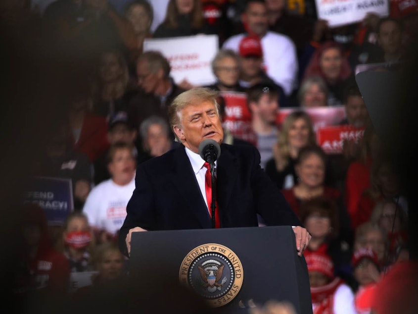 caption: Former President Donald Trump attends a rally in support of Georgia Republican Senators in December 2020.