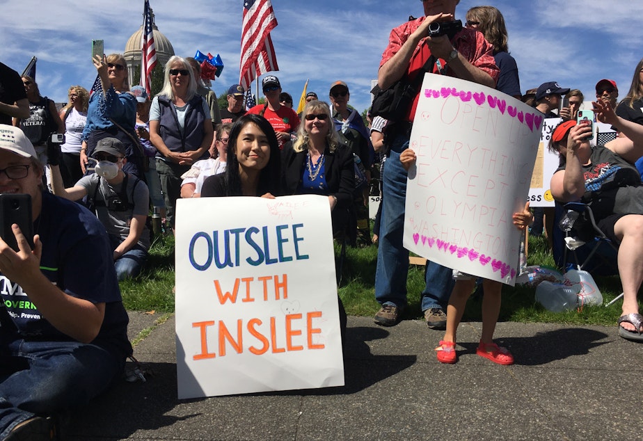 caption: Gov. Jay Inslee was the focus of ire at a 'Hazardous Liberty' rally at the Washington Capitol on Saturday. In recent weeks, Inslee has faced growing criticism from Republicans for his response to the COVID-19 crisis.