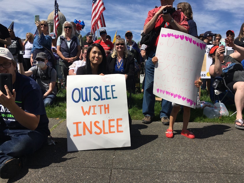 caption: Gov. Jay Inslee was the focus of ire at a 'Hazardous Liberty' rally at the Washington Capitol on Saturday. In recent weeks, Inslee has faced growing criticism from Republicans for his response to the COVID-19 crisis.