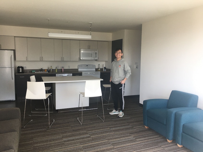 caption: UW sophomore Aaron Zhao in his apartment. His 3 other roommates have moved out already after the University of Washington opted to move spring quarter classes online. March 19, 2020.