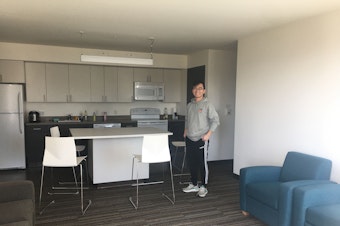 caption: UW sophomore Aaron Zhao in his apartment. His 3 other roommates have moved out already after the University of Washington opted to move spring quarter classes online. March 19, 2020. 