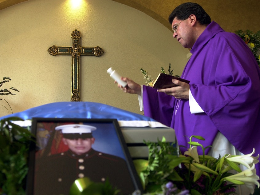 caption: The funeral of Lance Cpl. Jose Antonio Gutierrez in 2003. Gutierrez was born in Guatemala and served in the Marine Corps until he was killed in Iraq — one of a number of immigrants in the military.
