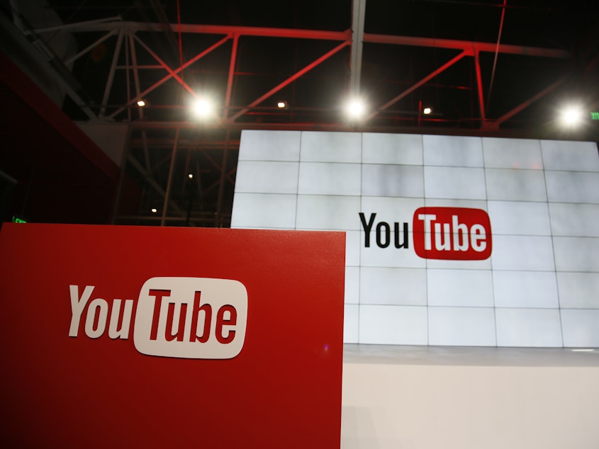 caption: YouTube announced changes Wednesday to its anti-harassment guidelines. The company has faced criticism in the past for failing to enforce its rule.