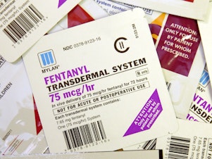 caption: A collection of fentanyl patches, clearly marked with warnings against non-prescribed uses, shown in 2006.