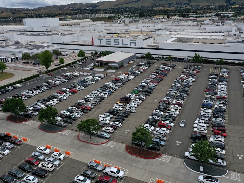 caption: An aerial view of the Tesla factory in Fremont, Calif., in May. Gov. Gavin Newsom signed an executive order on Wednesday that bans the sale of new gasoline-powered vehicles in the state by 2035.