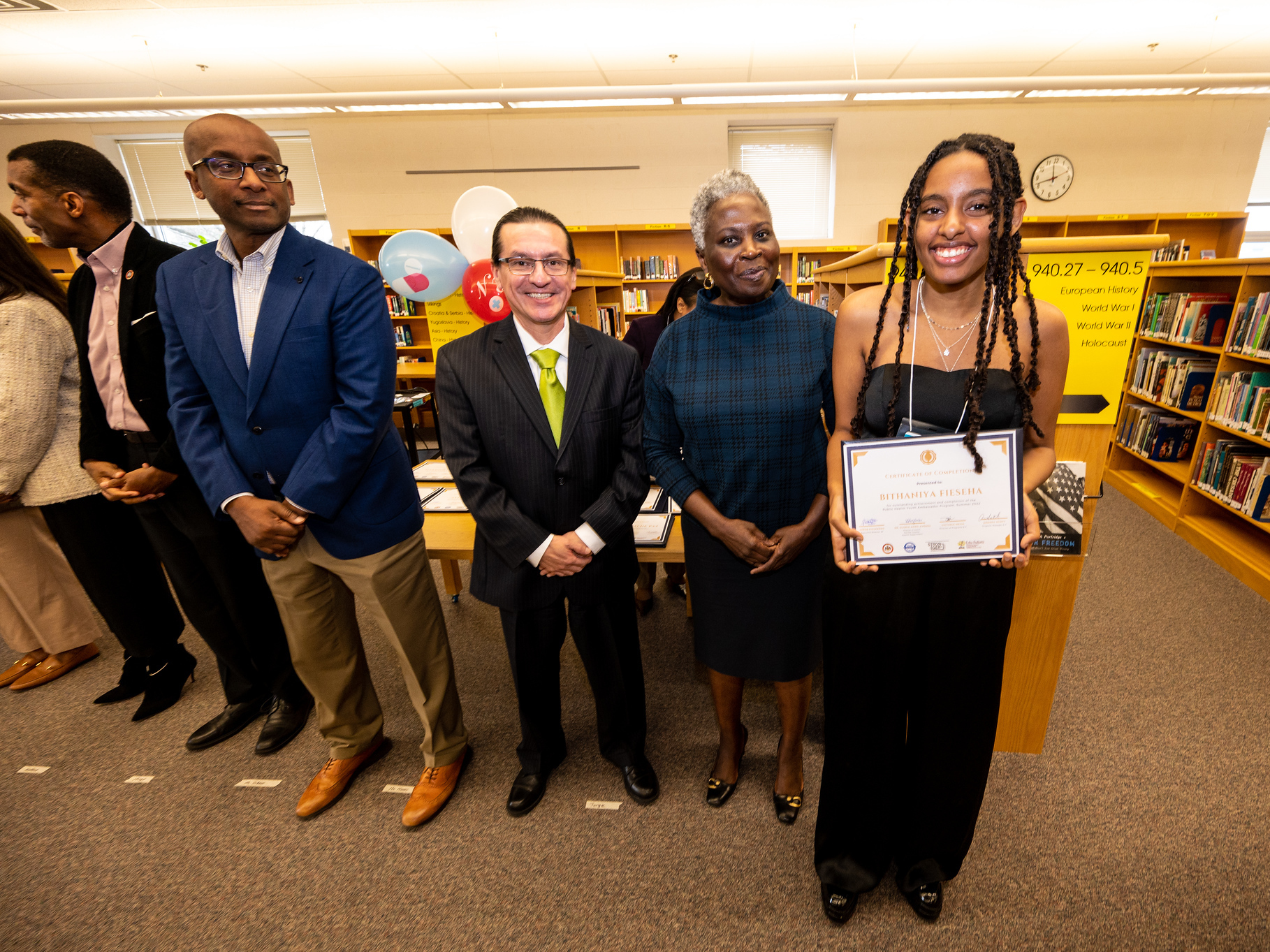 caption: Bithaniya Fieseha, a high school senior, graduates from the Youth Public Health Ambassador program run by the Fairfax County Health Department at West Springfield High School in Fairfax County, Va.