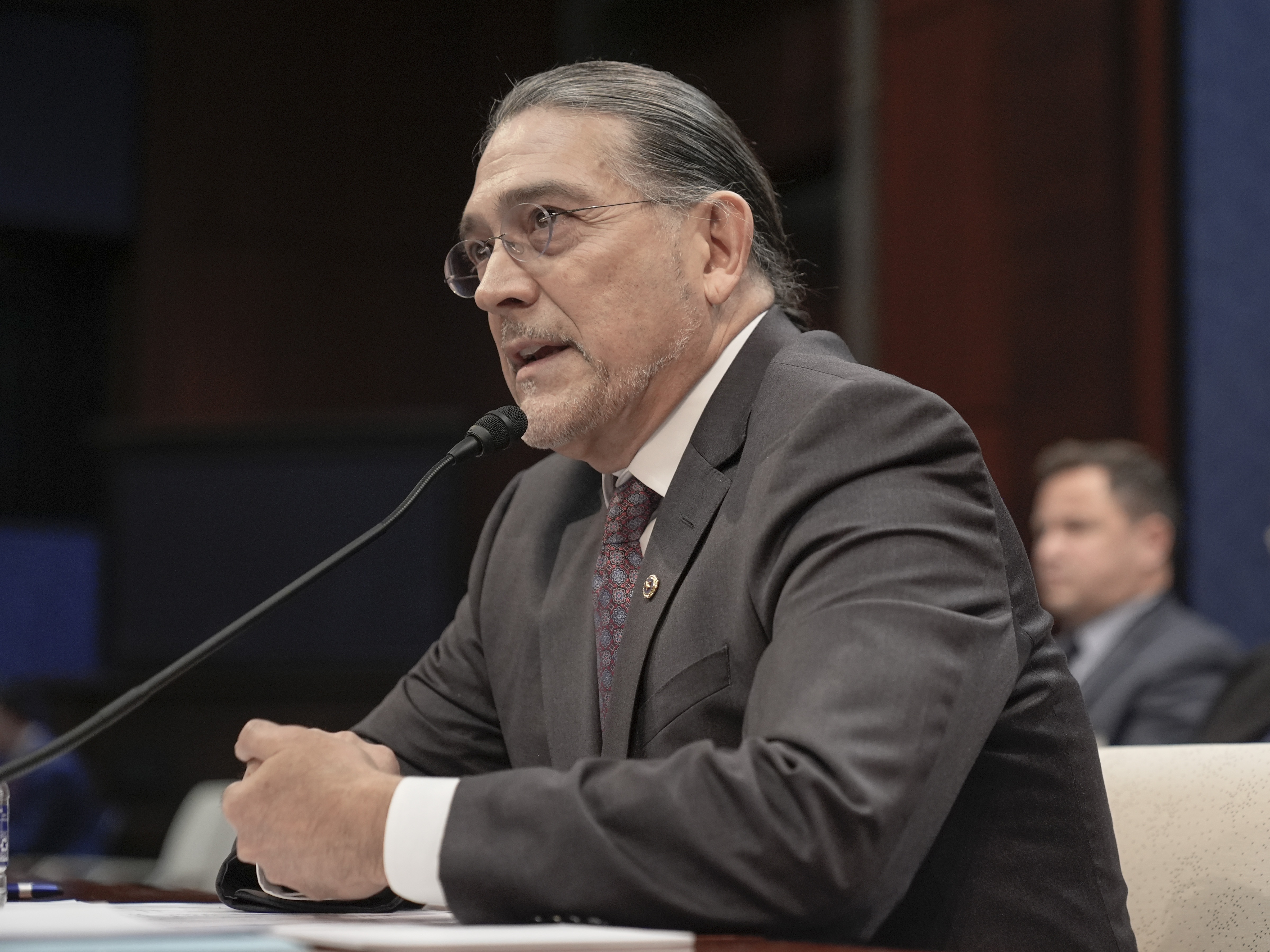 caption: U.S. Census Bureau Director Robert Santos testifies during a House Oversight Committee hearing on the bureau in December 2024 on Capitol Hill in Washington, D.C.