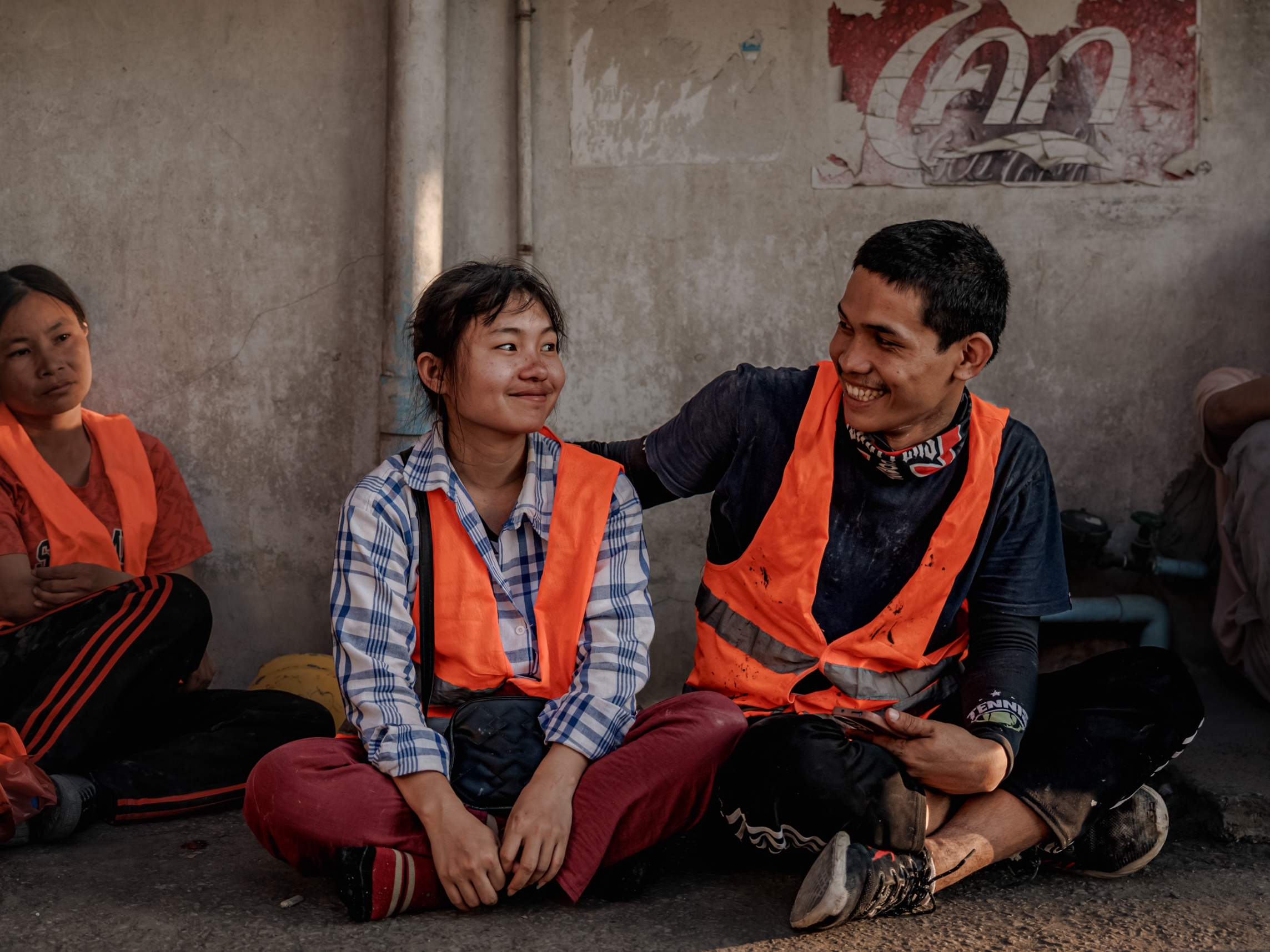 caption: After an earthquake struck Bangkok, these migrant workers from Myanmar shared a kind smile amid the shock and disbelief.