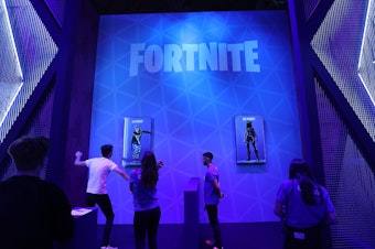 caption: A Fortnite fan performs a dance at the Gamescom gaming industry event in August.