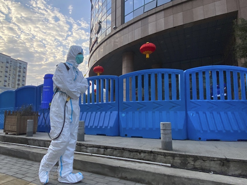 caption: A new U.S. intelligence report could not conclude whether the SARS-CoV-2 virus escaped from a lab in Wuhan, China or spilled over from an infected animal. Without more information about the early days of the outbreak, a more definitive explanation is unlikely, the report found.