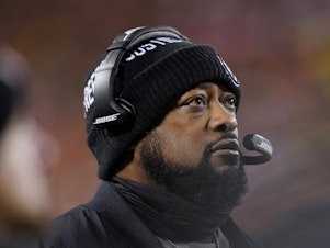 caption: Pittsburgh Steelers head coach Mike Tomlin watches from the sideline during the first half of an NFL wild-card playoff game against the Kansas City Chiefs in January. Tomlin is currently the league's only Black head coach.