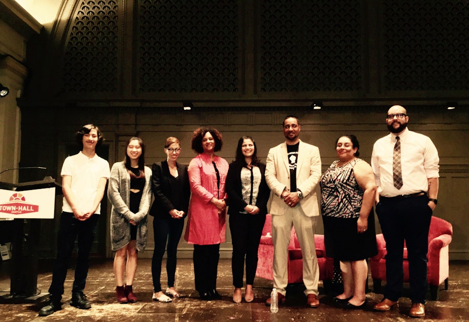 caption: Left to right: Sage Cook, Christina Joo, Kristin Leong, Joy Williamson-Lott, Saraswati Noel, Jesse Hagopian, Sharonne Navas and Nathan Simoneaux at Town Hall Seattle