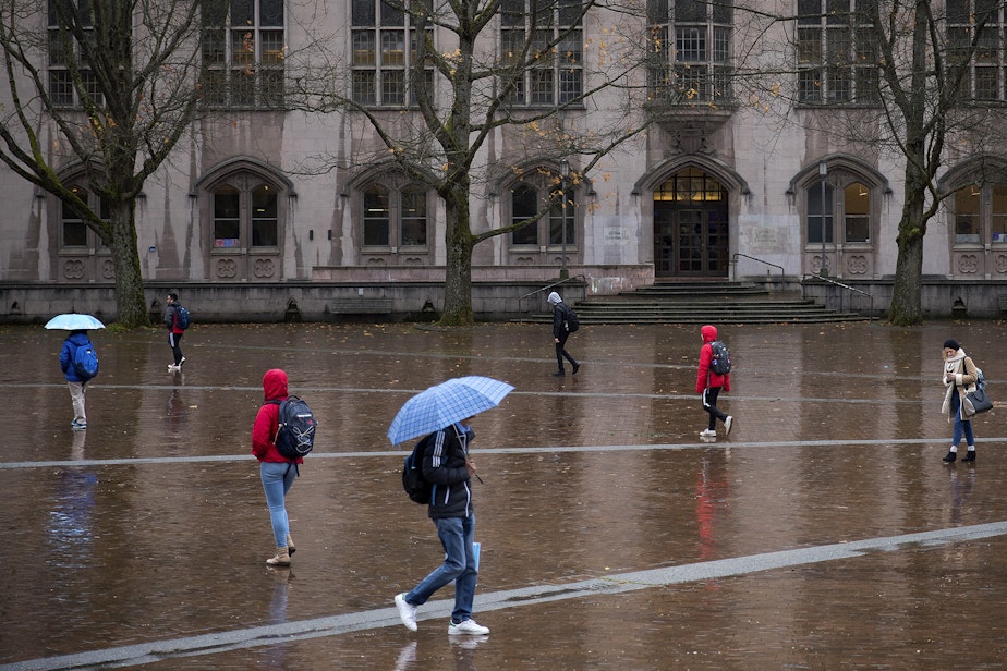 caption: Students walk in front of Gerberding Hall on Thursday, November 16, 2017, on the University of Washington campus in Seattle. 