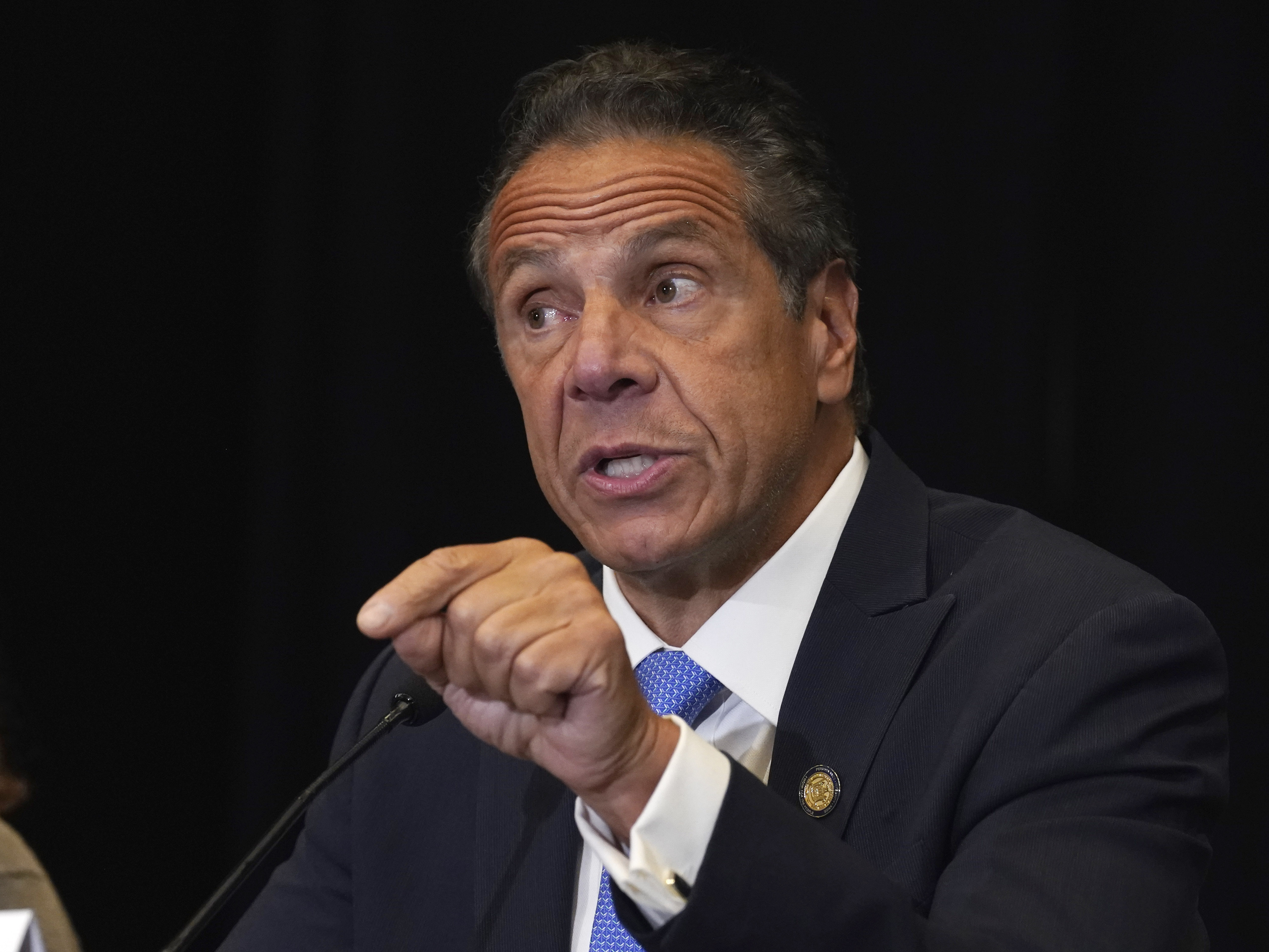caption: New York Gov. Andrew Cuomo speaks during a news conference at New York's Yankee Stadium in July.