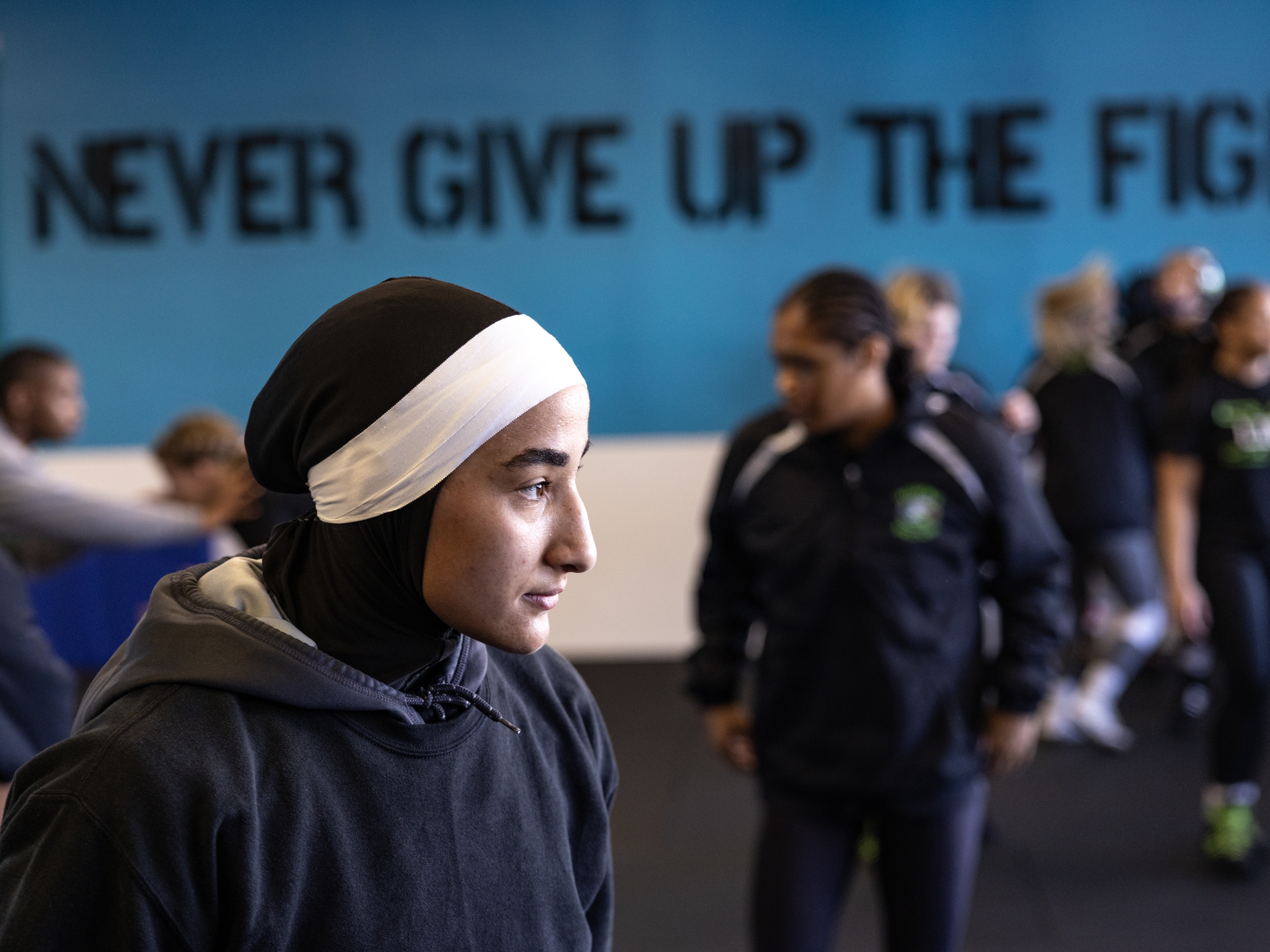 caption: Jamilah McBryde works up a sweat to cut weight in preparation for the 2025 National Association of Intercollegiate Athletics (NAIA) Women's Wrestling National Championship, hosted in Wichita, Kan., in March.