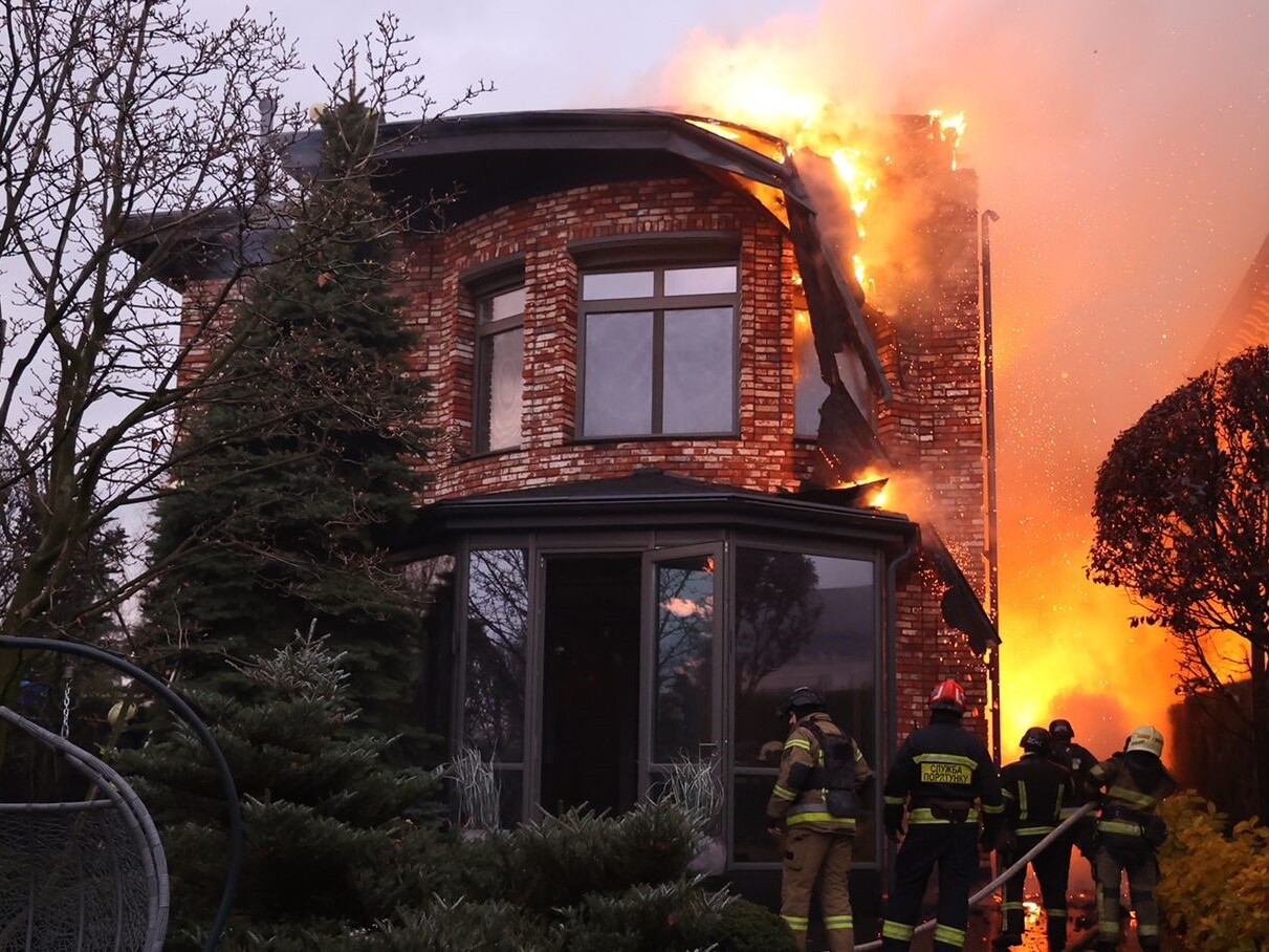 caption: Emergency units carry out rescue tasks after a Russian attack on the city of Dnipro, in central Ukraine, on Thursday. Ukrainian officials are trying to determine whether Russian forces launched an intercontinental ballistic missile and other types of missiles.