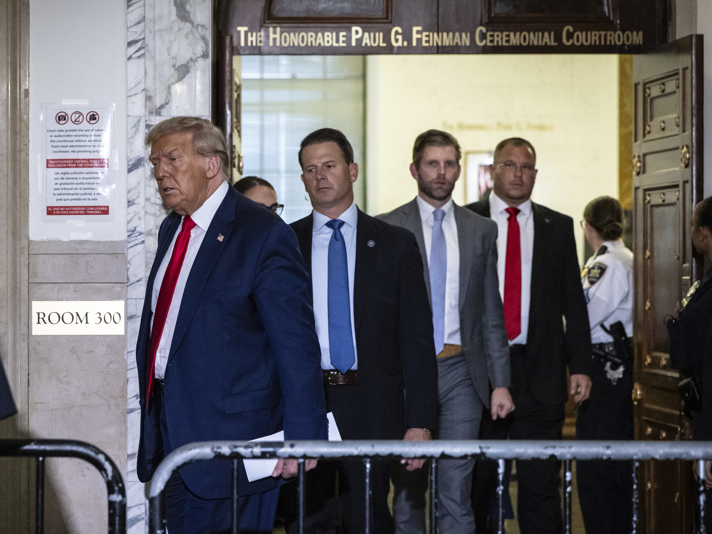 caption: Former President Donald Trump leaves the courtroom during a break in his civil fraud trial on Oct. 17 in New York.
