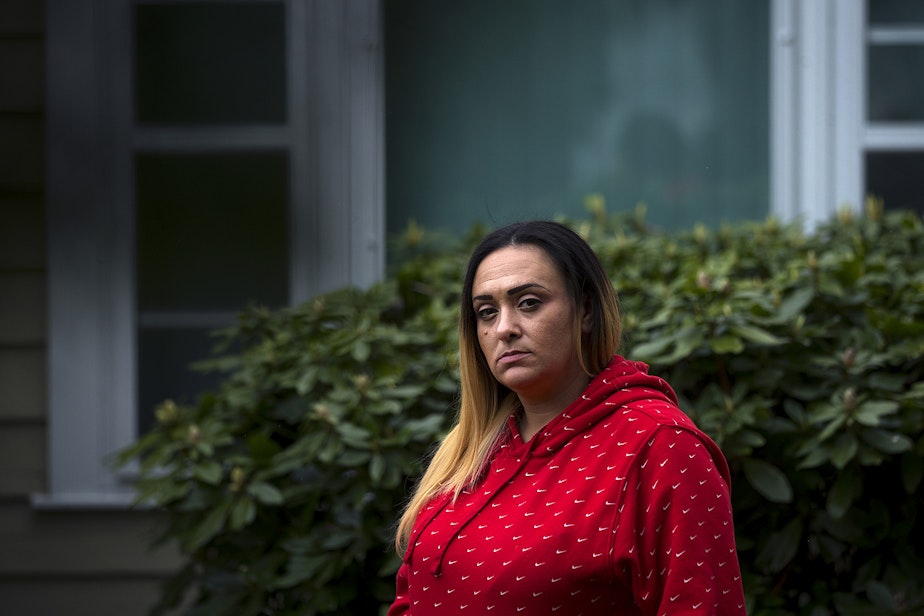 caption: Kandis Mello stands for a portrait on Friday, May 1, 2020, at her home in Burien. "I feel like I'm set up for failure," said Mello. "I would have rather stayed in prison and not put this burden on my family."